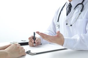 A doctor conducting a medical examination with a patient.