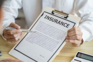 Insurance Adjuster showing contract to TBI Claimant