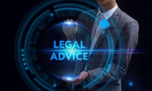 Young businessman interacting with a virtual screen displaying 'Legal advice