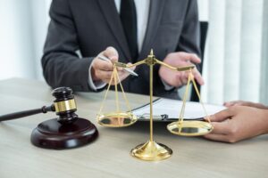 A male lawyer discussing a legal case and negotiating with a client in an office setting, representing law and justice.