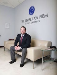 Attorney Michael K. Grife Sitting on a Sofa, The Grife Law Firm